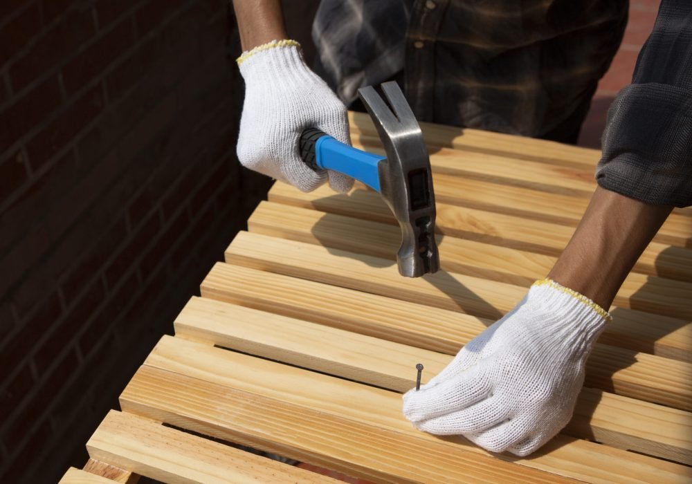 construction-worker-using-hammer-job-site
